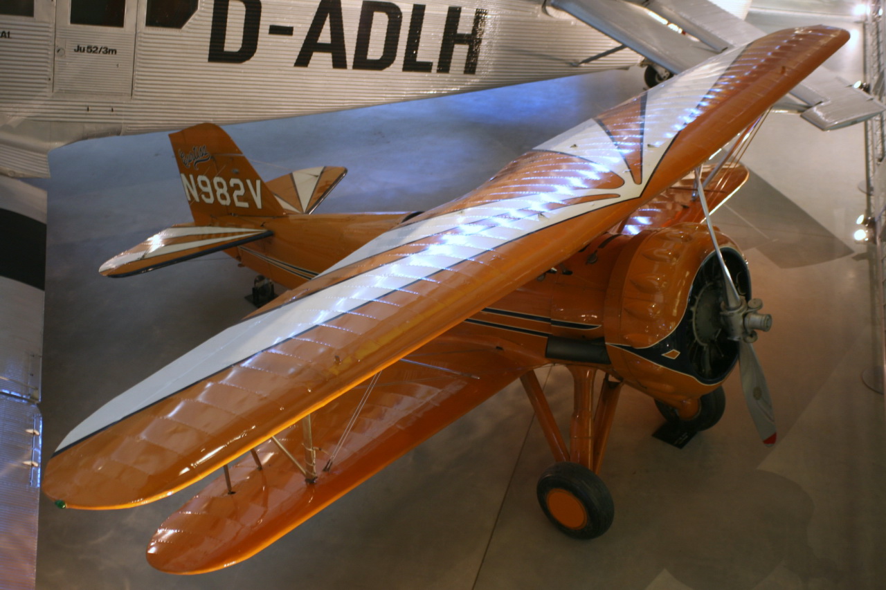 a small air plane next to a larger one