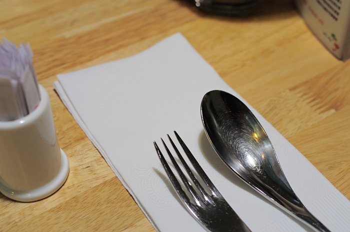 a plate with a fork, knife and spoon on it