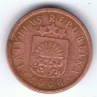 an antique copper coin with the coat of arms