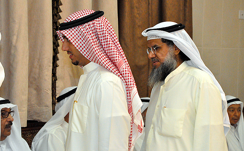 several men standing around and talking to each other