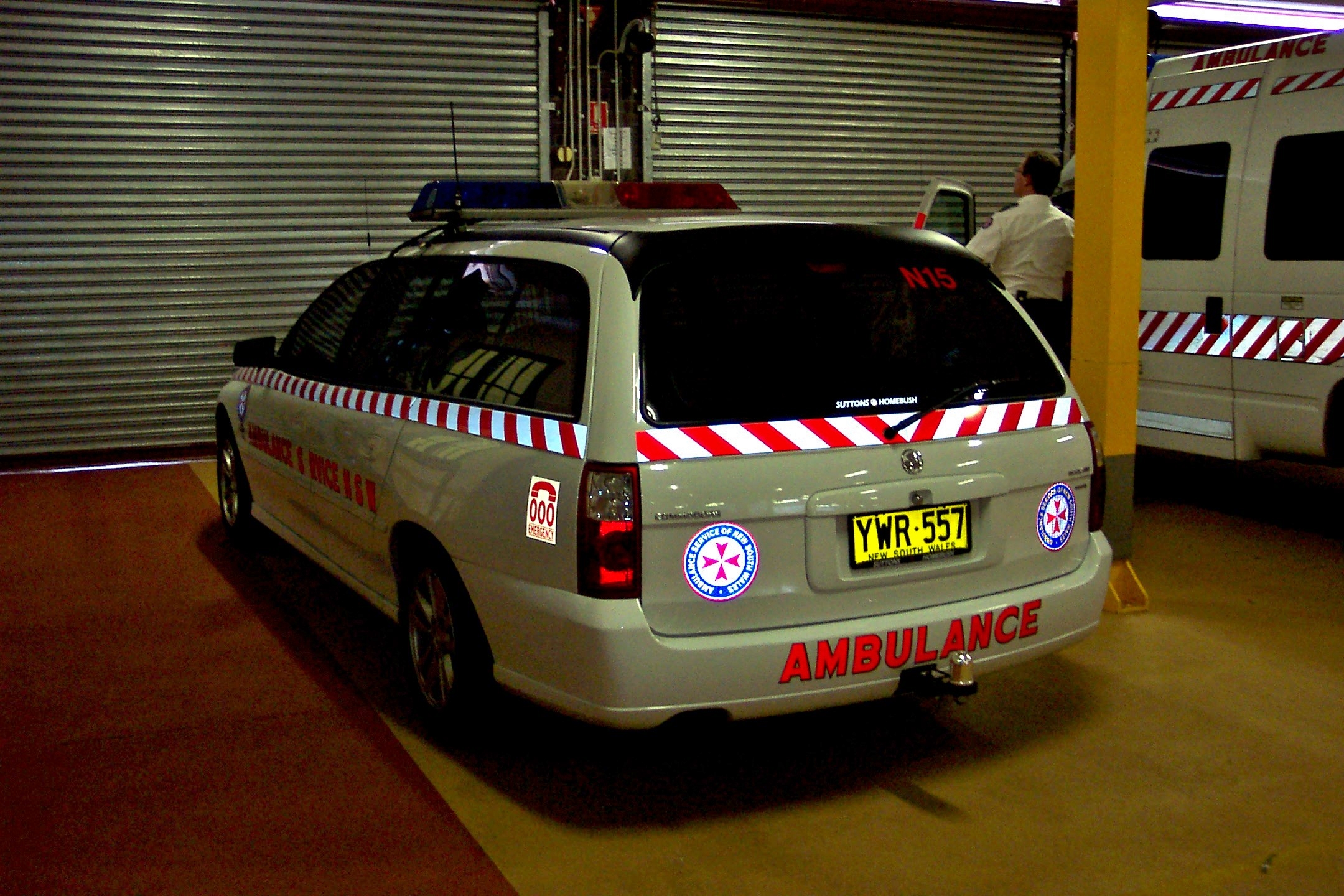 a vehicle parked in a garage on a sidewalk