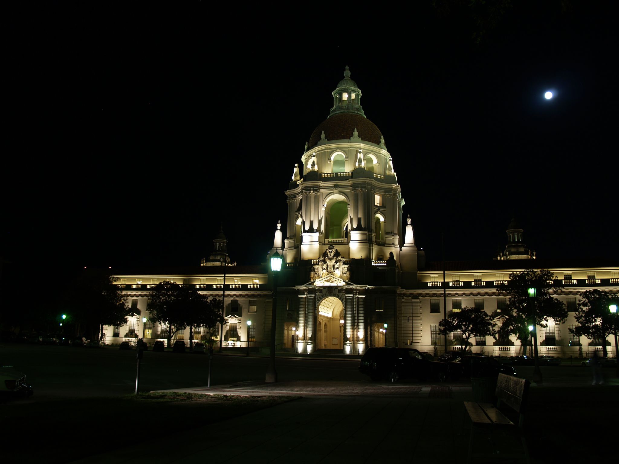 a large building at night with lights shining