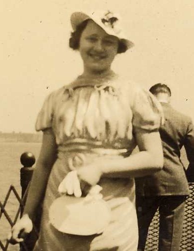 old pograph of woman on a boat in the ocean