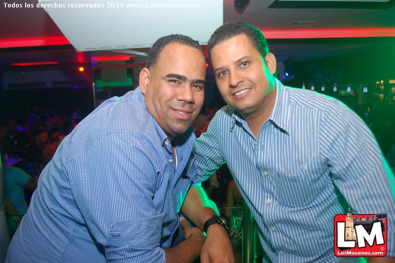 two men pose for a picture in the club