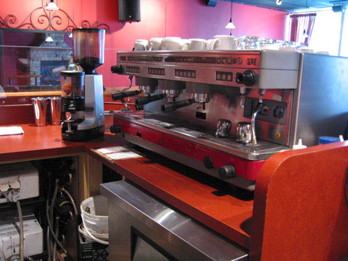 red kitchen furniture and appliances in an industrial restaurant