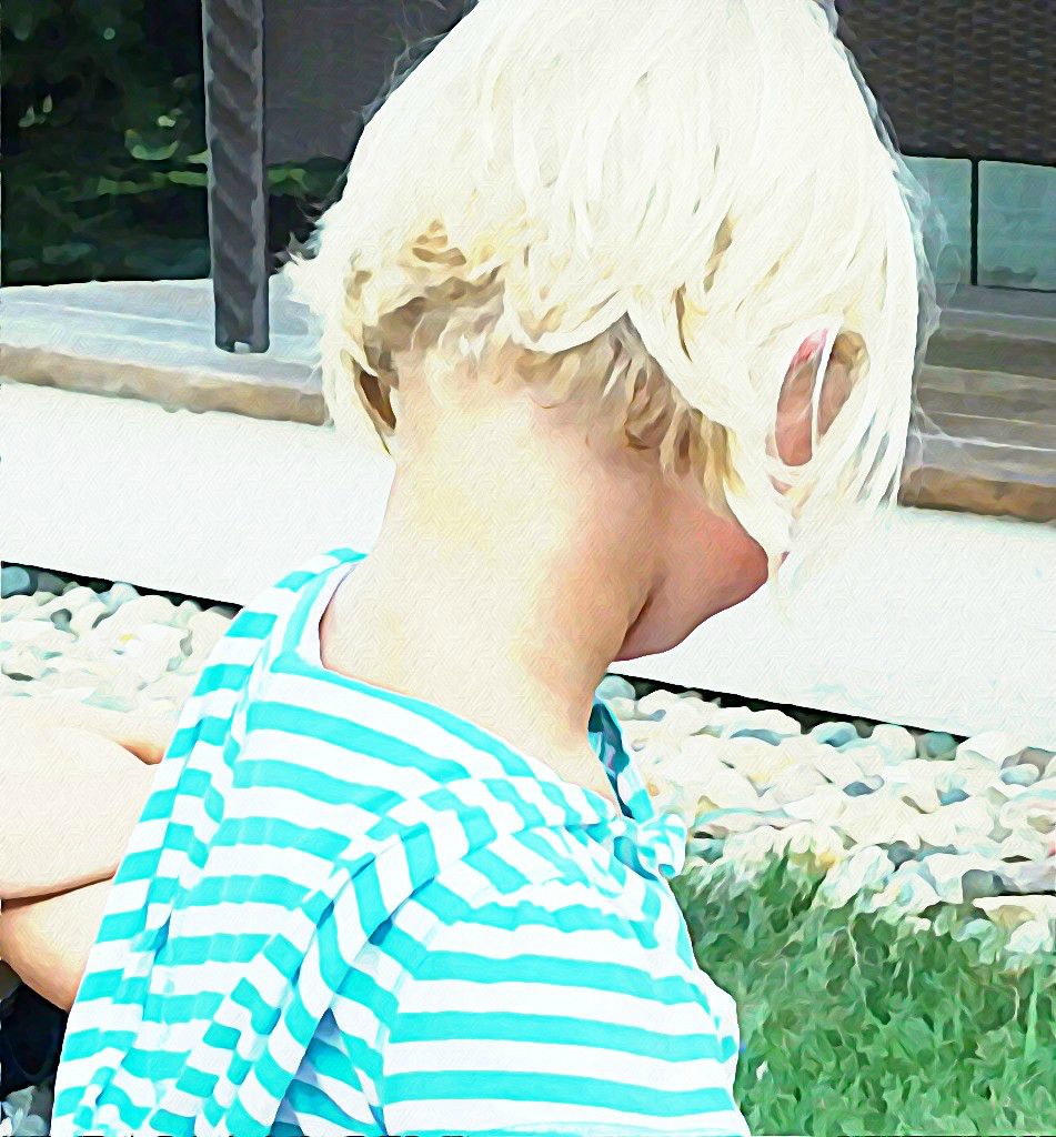 boy with blond hair in striped shirt and glasses