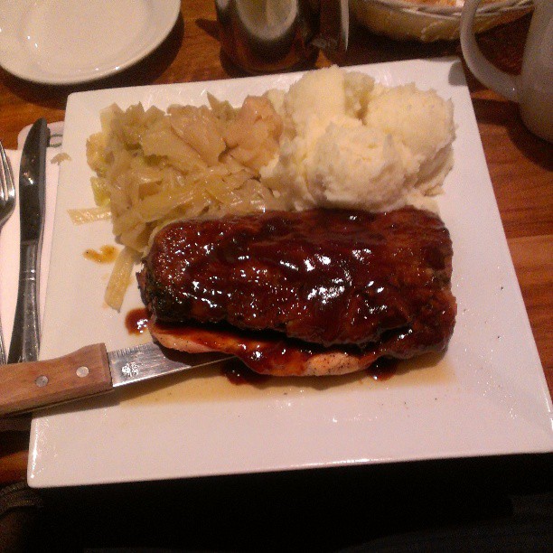 there is ribs, mashed potatoes and some meat on a plate