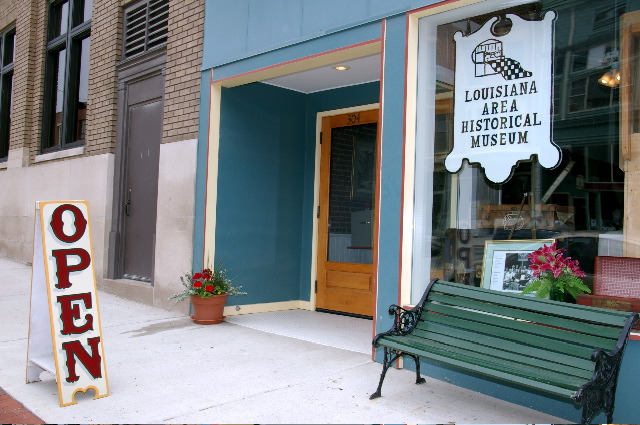 a store front is decorated with antiques and signs