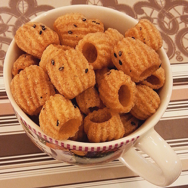 a bowl full of cookies in the shape of teddy bears