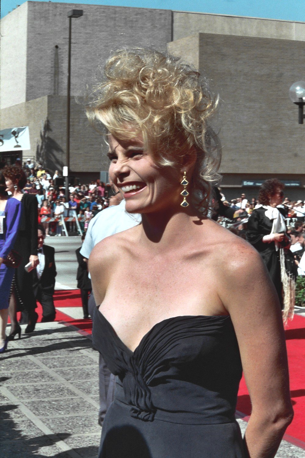 woman wearing black dress in front of audience