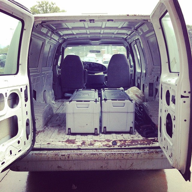 an suv is shown with white cargo and two doors opened