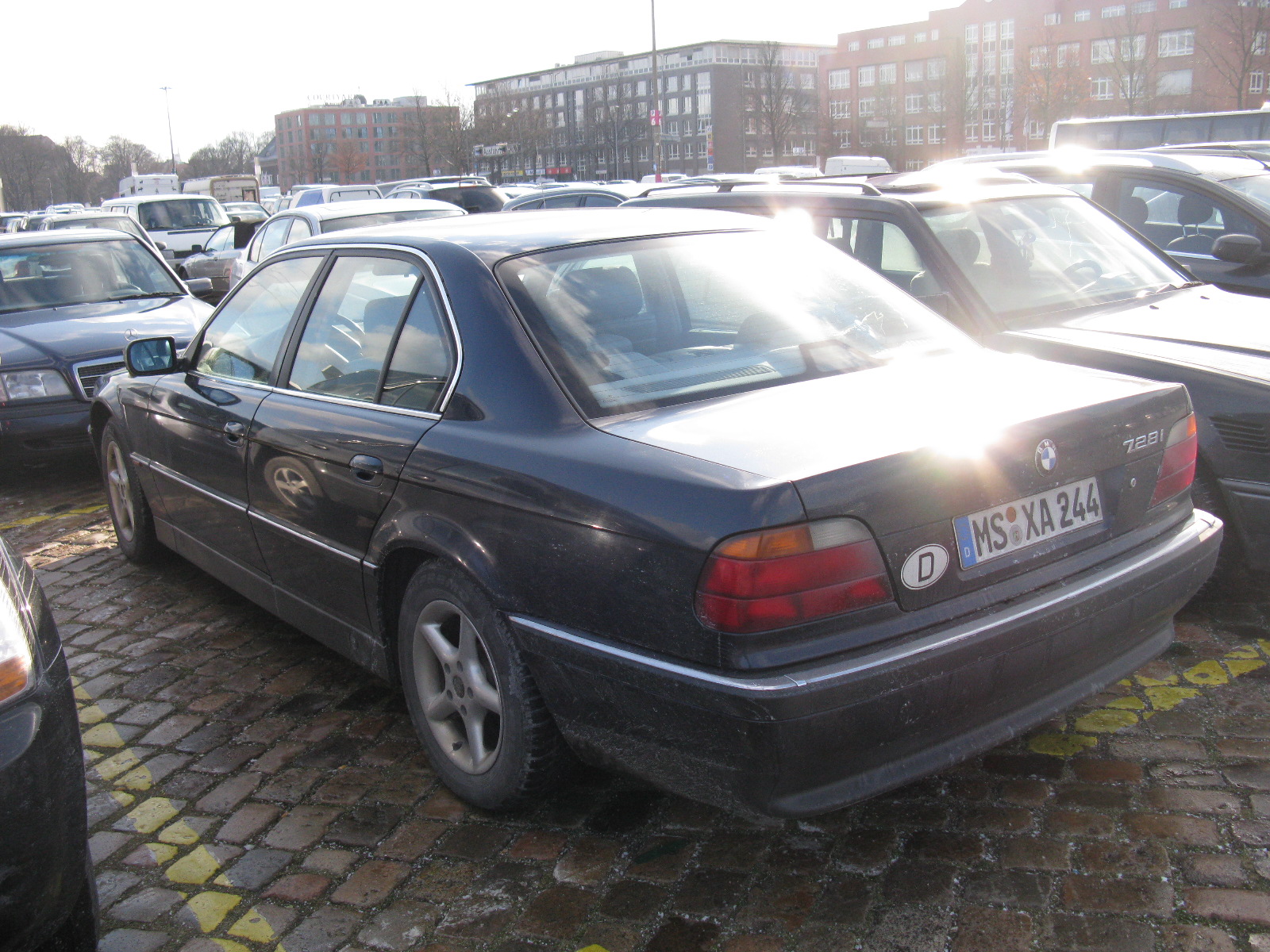 a bunch of parked cars in the city