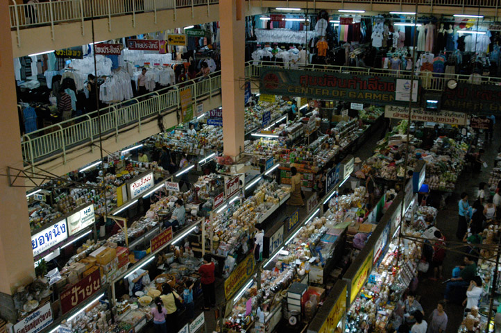 a wide s of people shopping in an indoor market