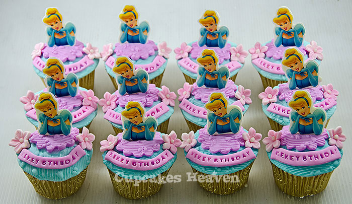 there are a bunch of cupcakes with princesses on them