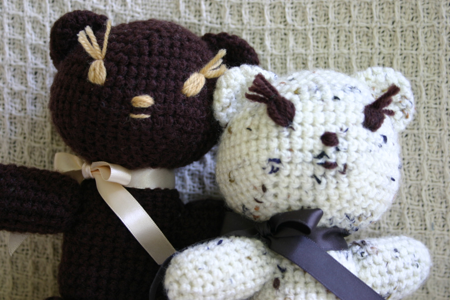 two knitted teddy bears in the shape of bears