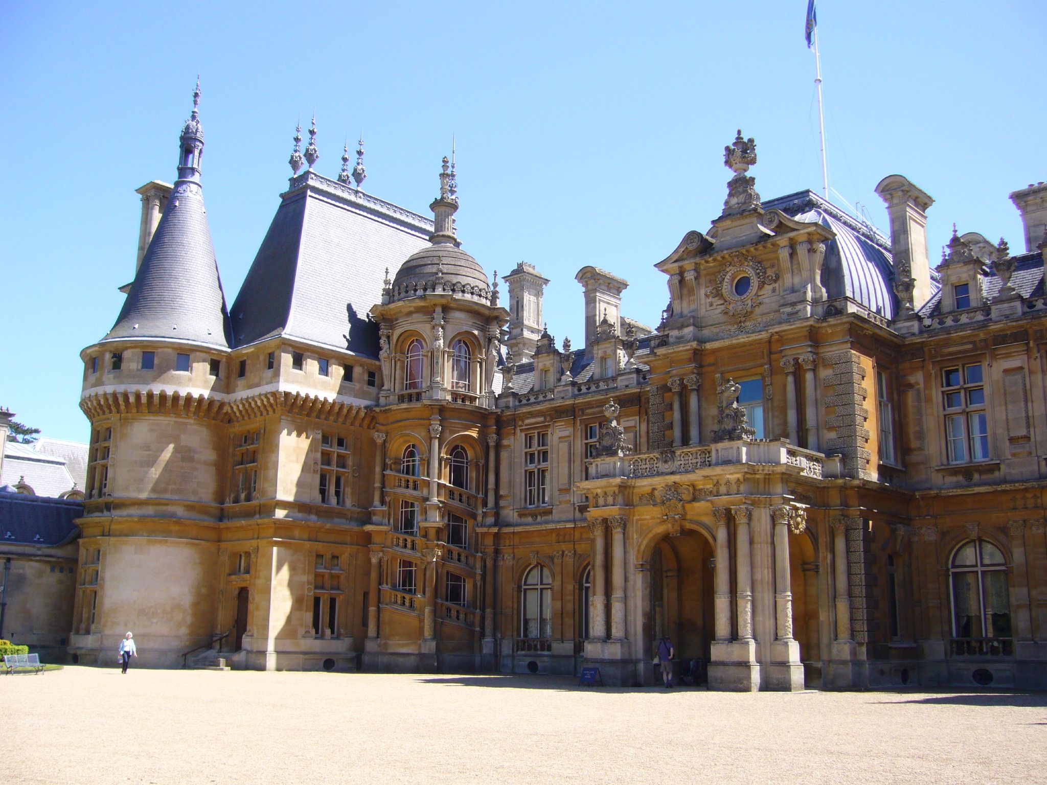 a large building is made up of multiple stone towers