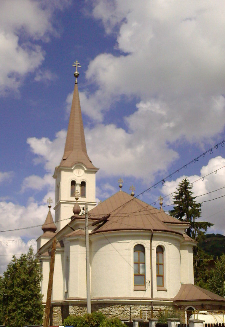 the front view of a church in a rural area