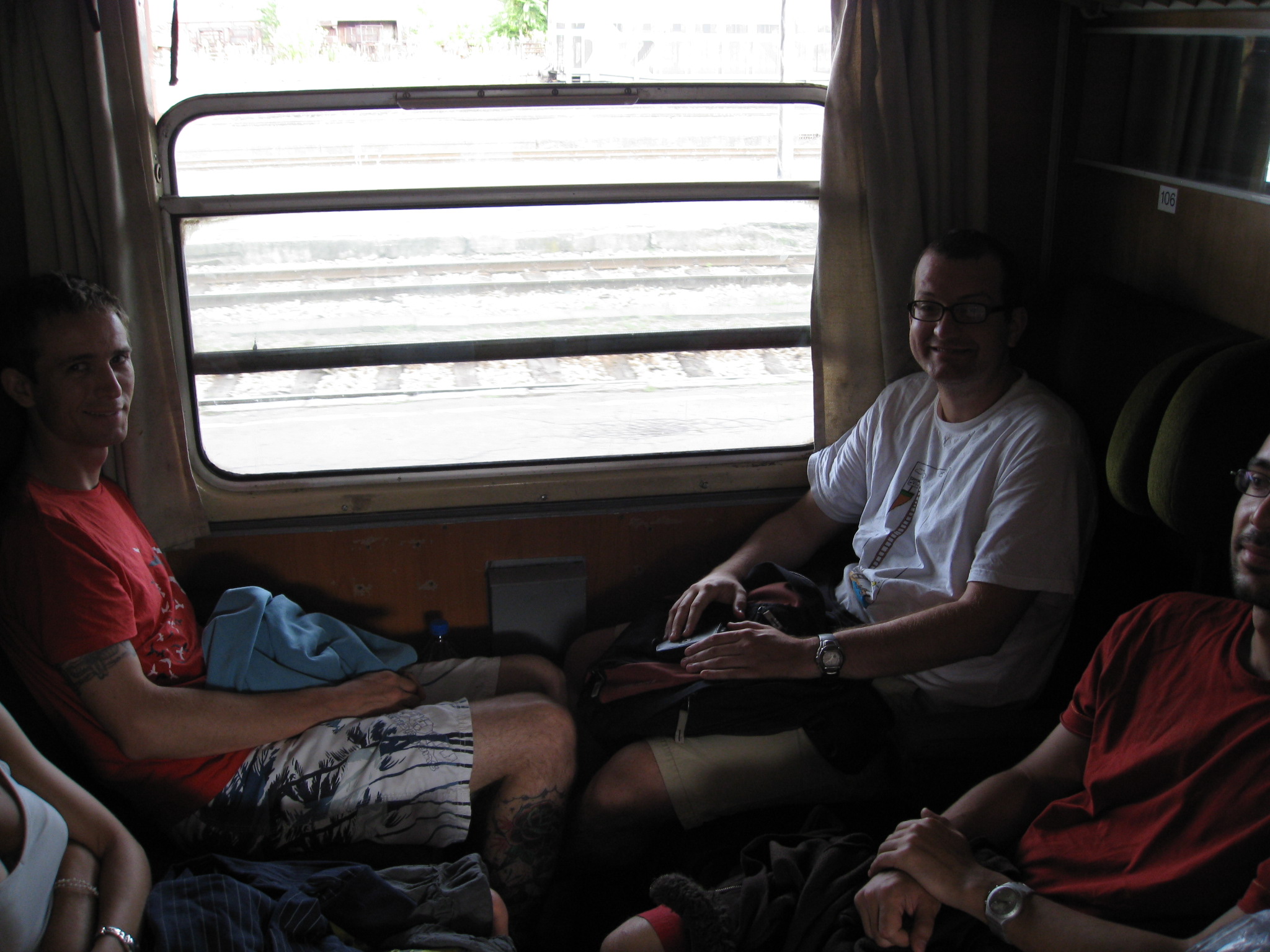 people sitting in the front of a train car