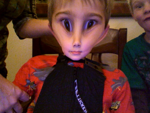 a boy dressed as a alien is being examined