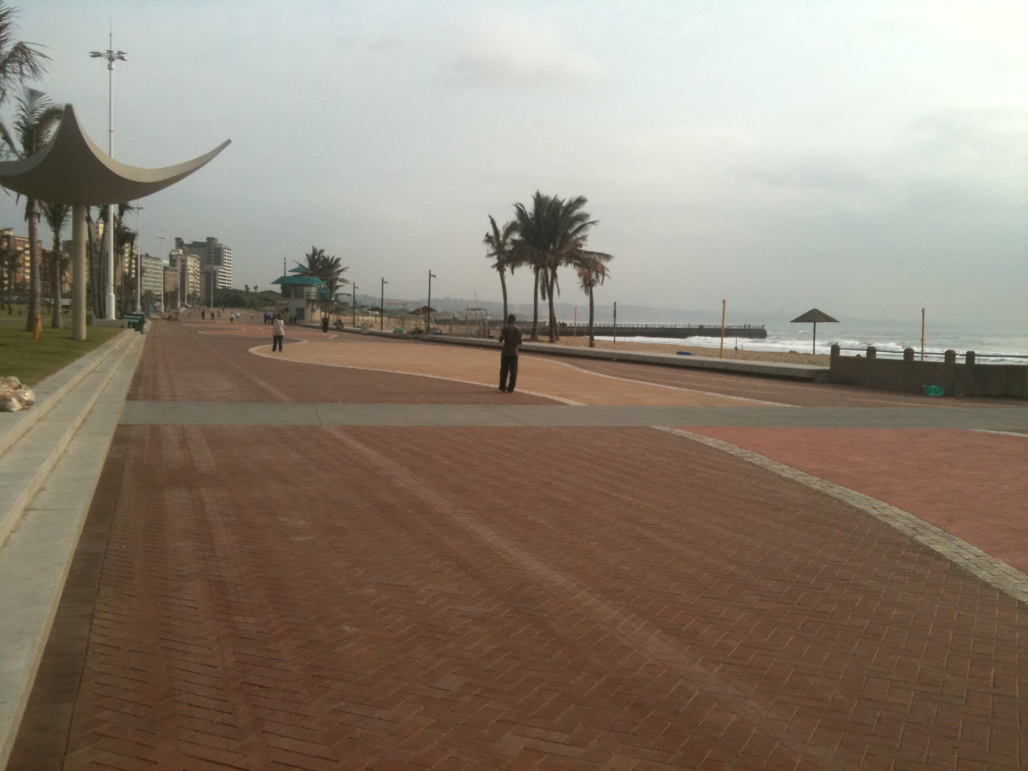 a man that is standing in the street by himself