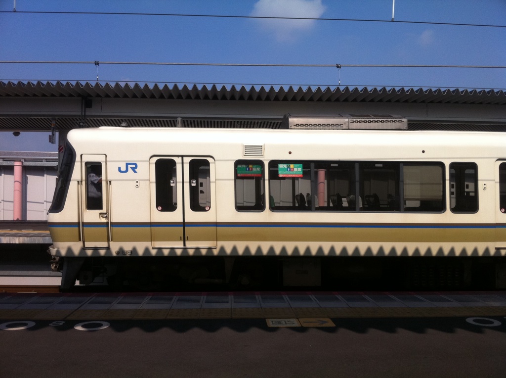 a train sits in the station with one open window