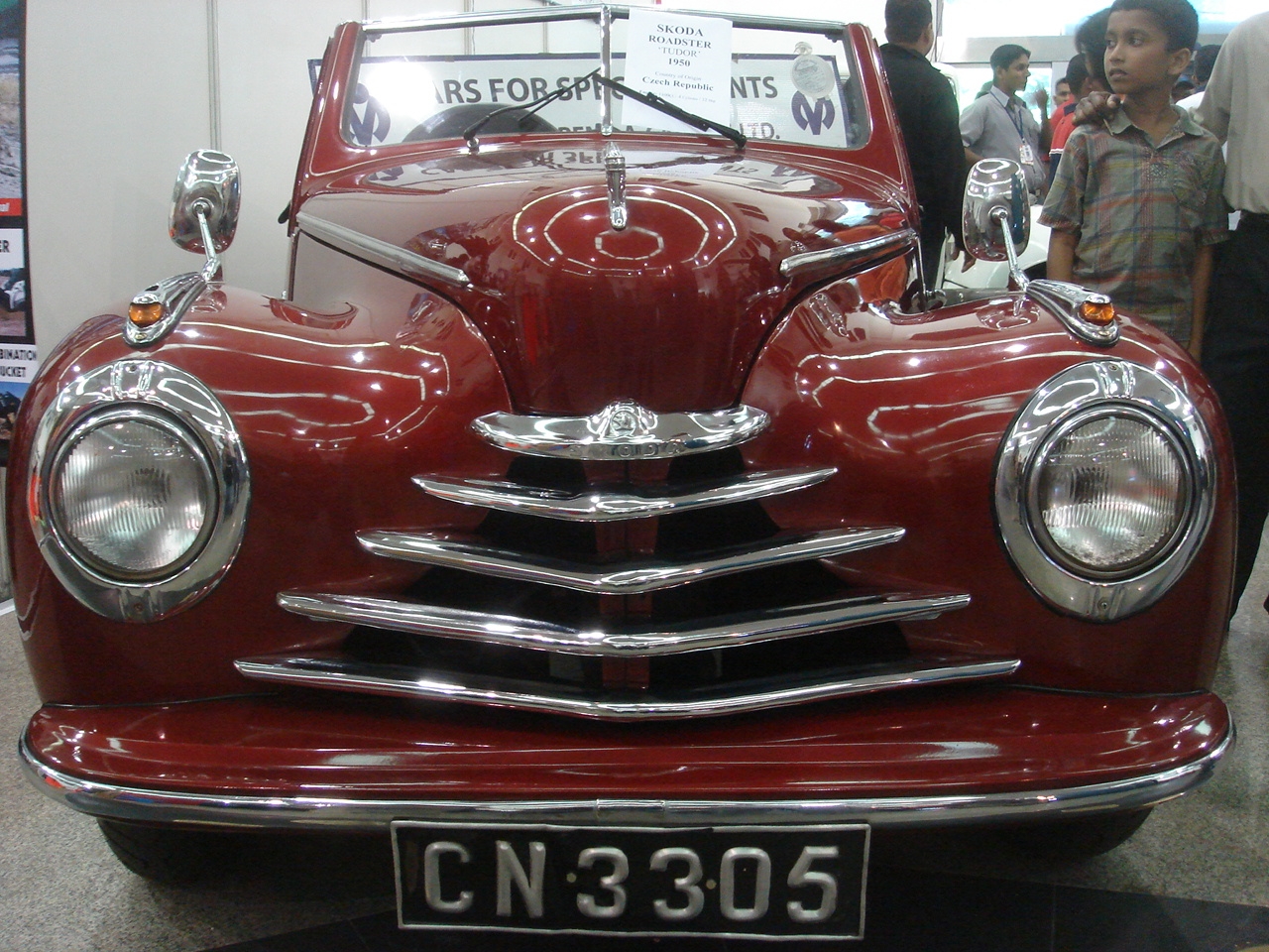 a vintage car on display at a show
