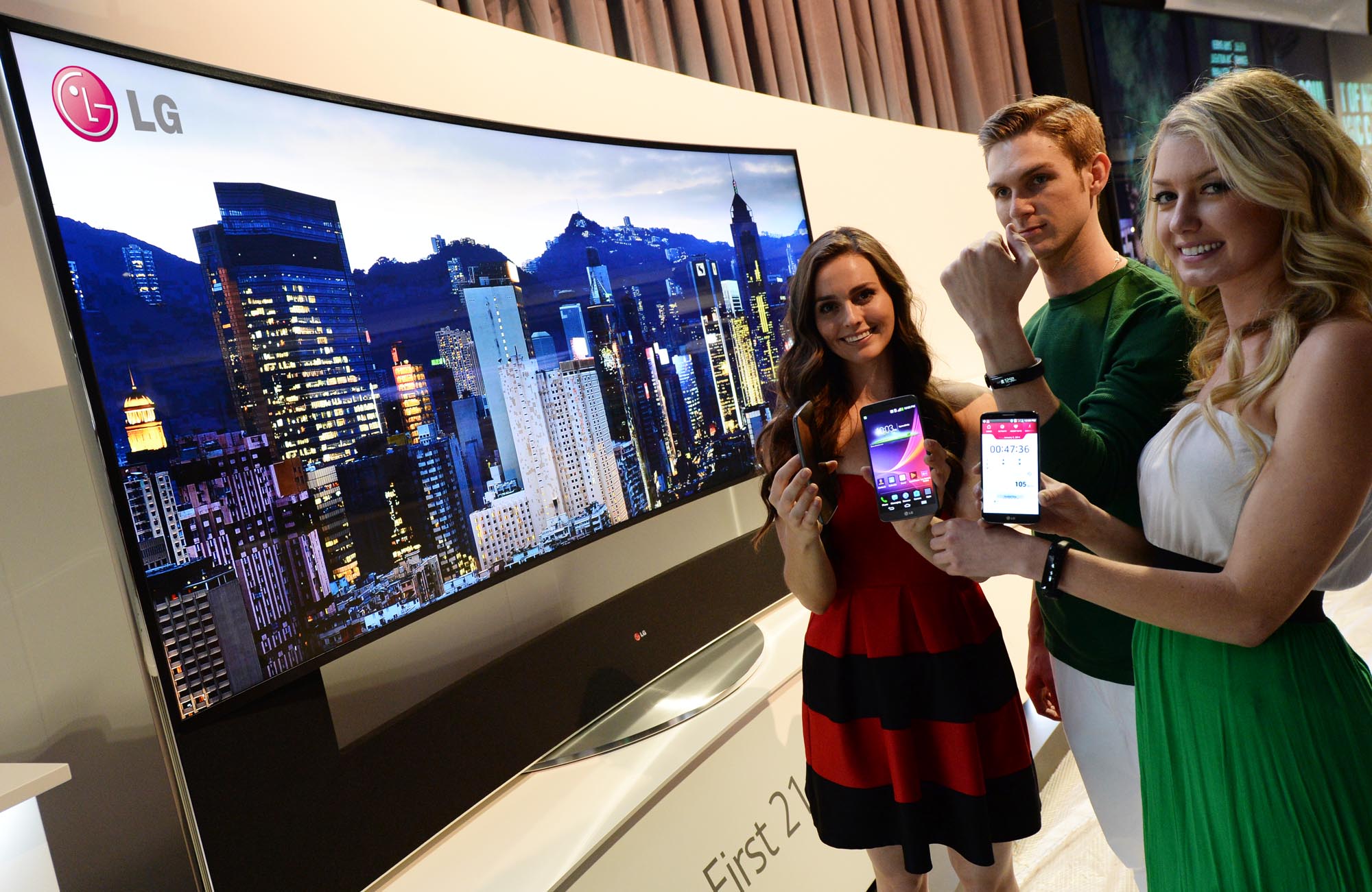 a woman with a cell phone standing next to other women