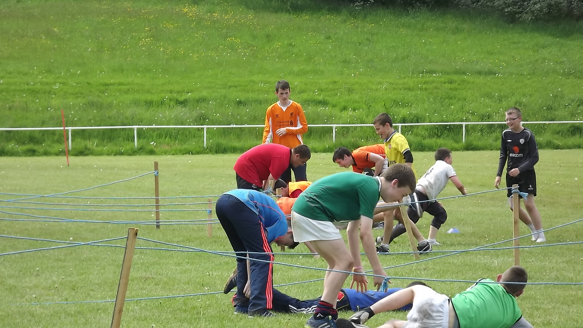 a group of people standing around each other