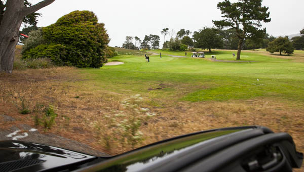 a golf green being viewed from the top of the car