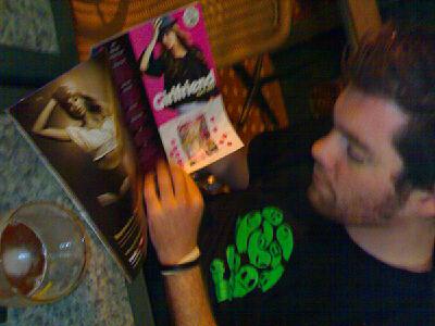 a man sitting at a table with some books