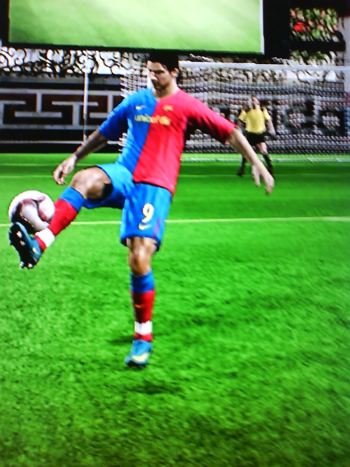 a guy in soccer clothes kicking a ball