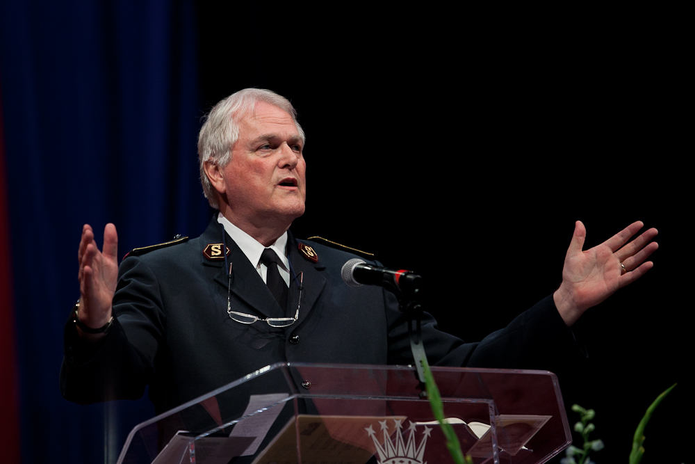 an official military giving a speech at a podium