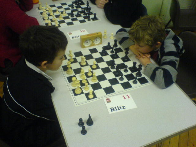 s playing chess in a school class at the school