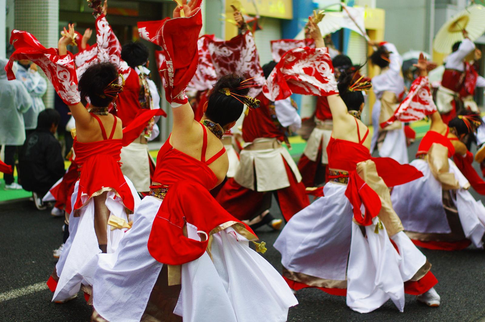 a group of women in costume performing an oriental dance