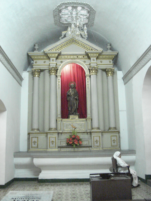 an altar with a shrine statue in it