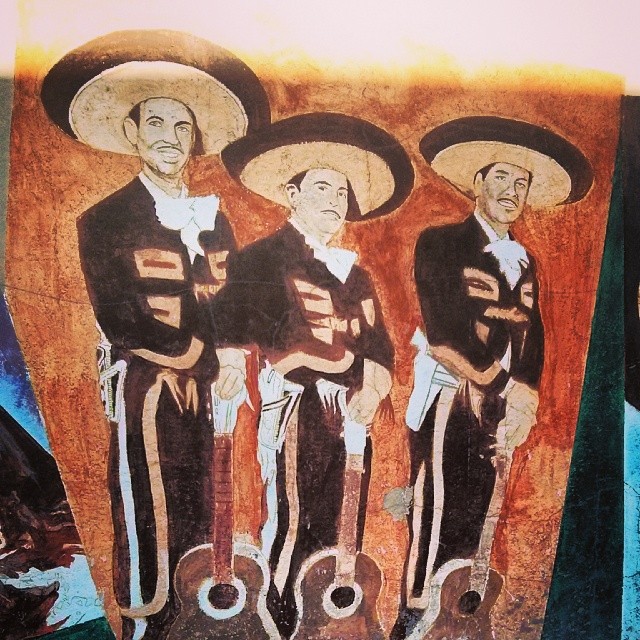 this picture depicts mexican art depicting three people
