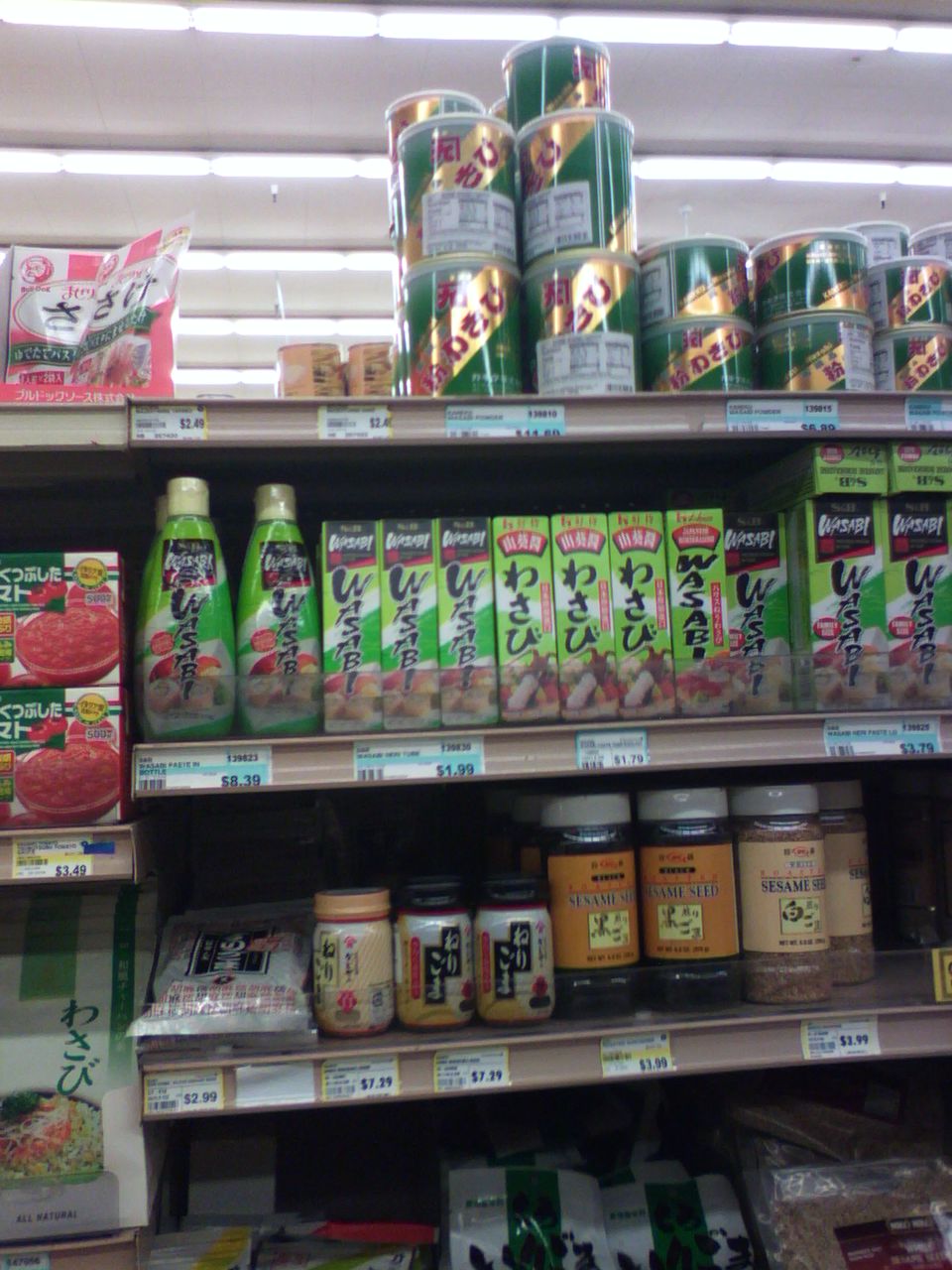 a grocery store shelf displays variety of food products