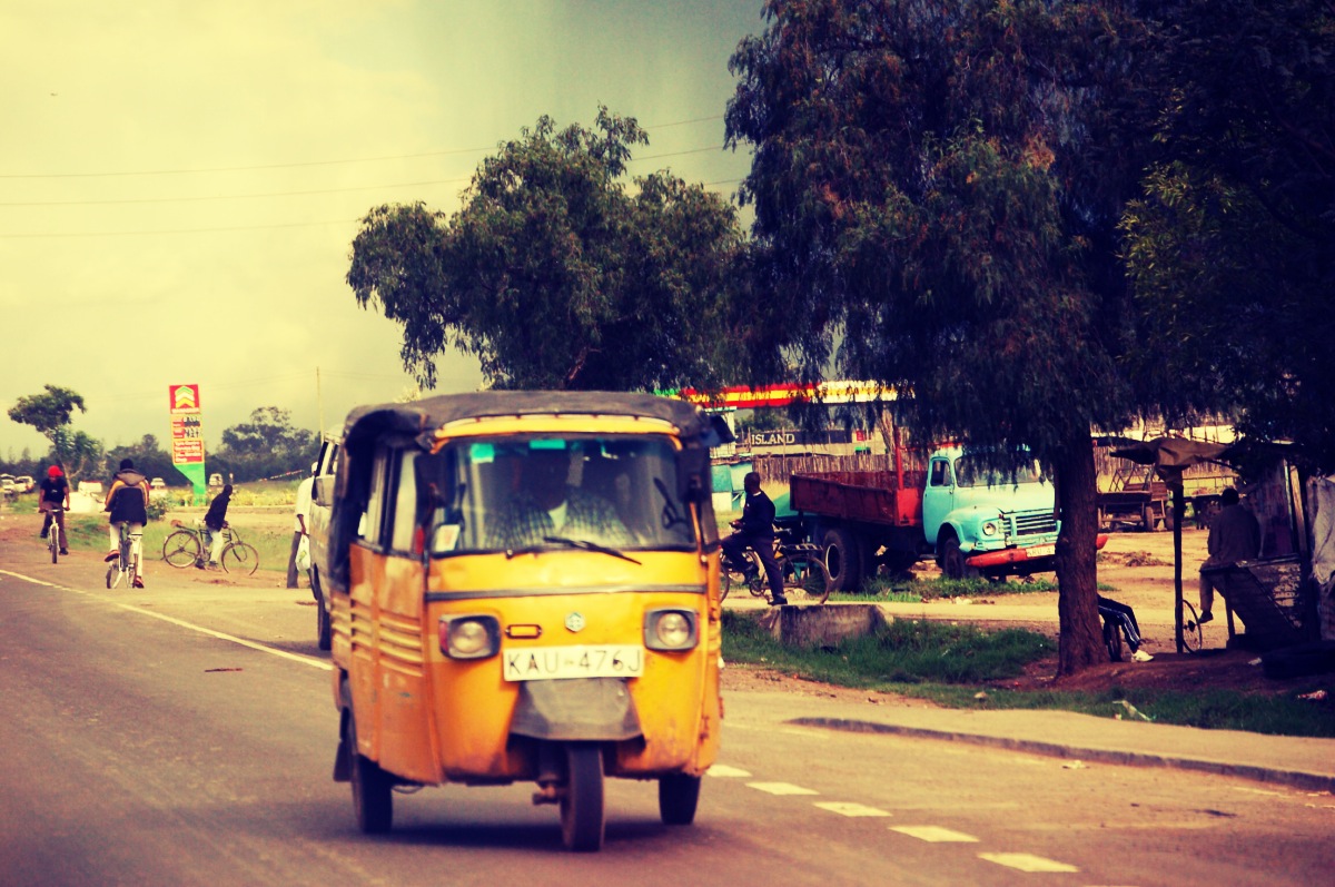 the motorcycle is on the road with the passenger in it