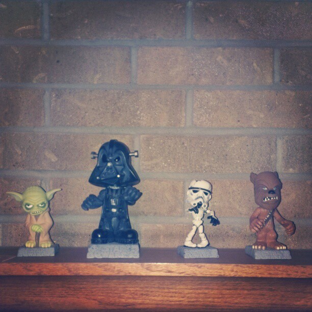 small star wars figurines on a shelf