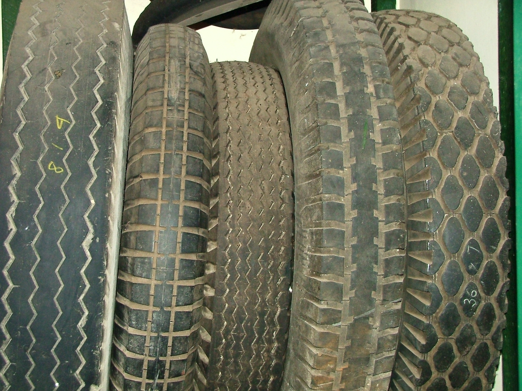 tires stacked on top of each other next to a tire
