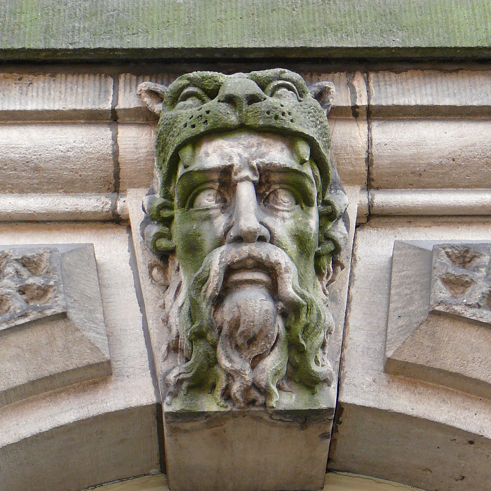 a large statue of an old man with a beard