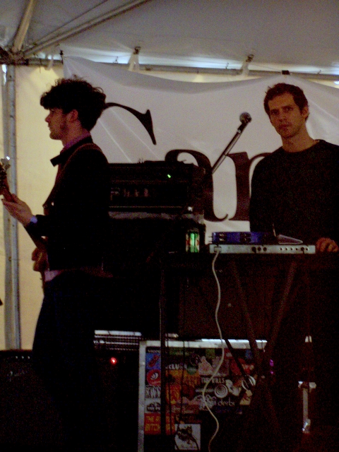 a band performing on stage at an event
