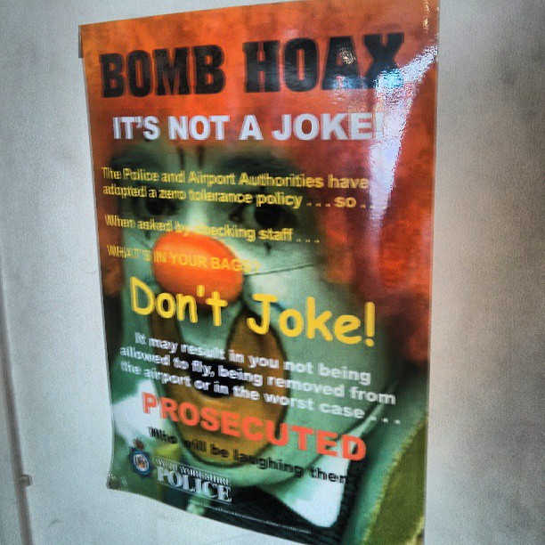 a poster that says bomb hoax it's not a joke on the door