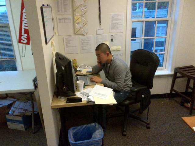 a man working at his desk on a computer