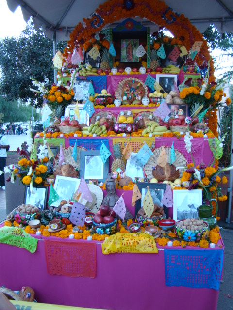 there is a colorful shrine with pos and signs on it