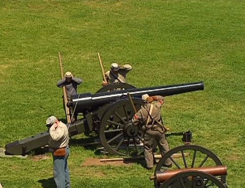 civil war reenactment with cannon guns and other equipment