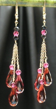 the dangling earrings have many crystal beads and chains