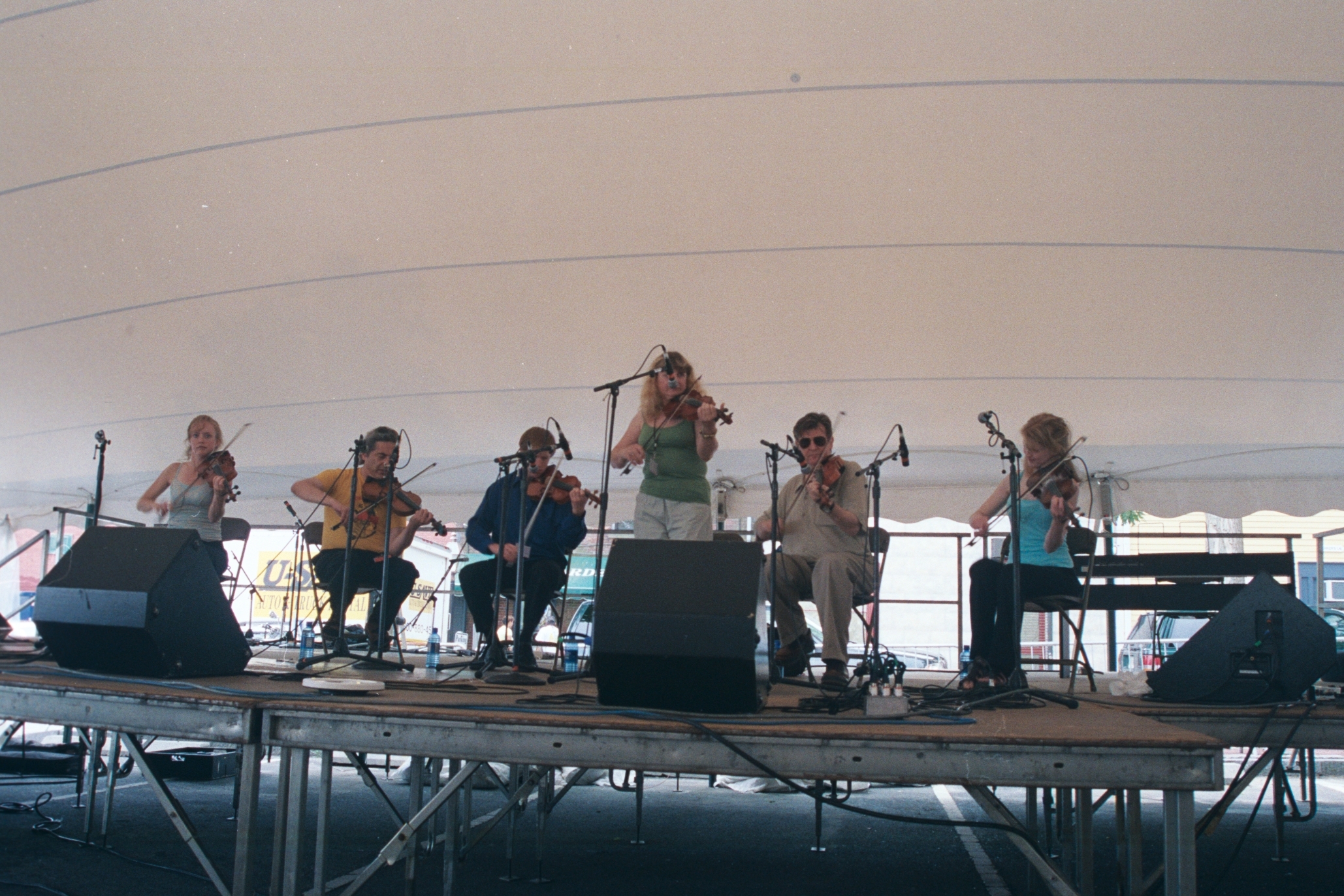 a group of people on a stage playing instruments