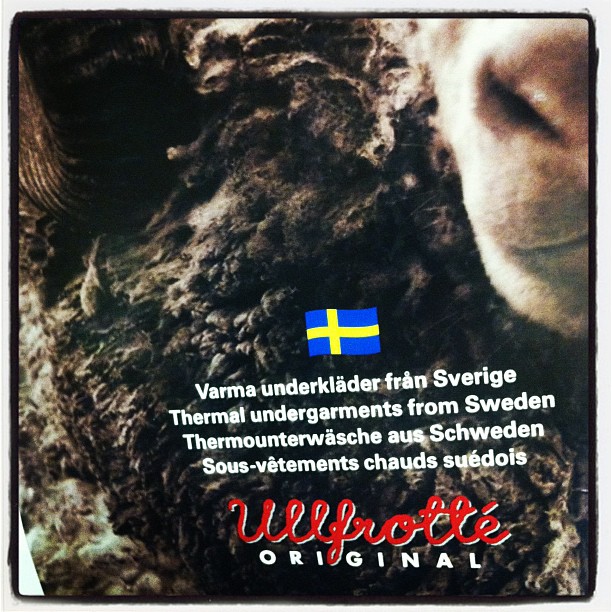 there is a picture of sheep that is black with the swedish flag