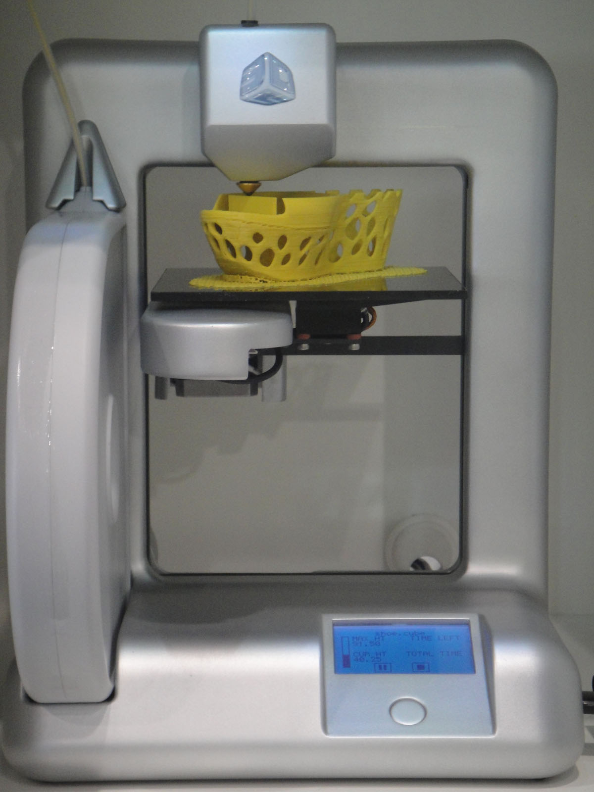 a machine with a basket of food in the middle